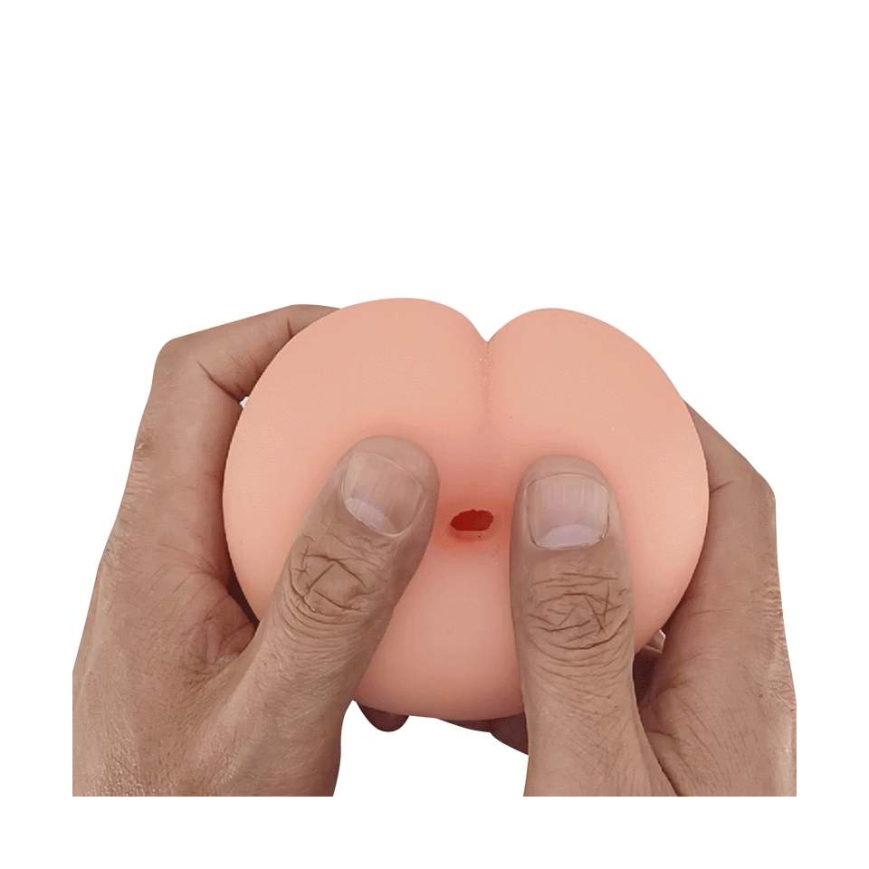 Atrakcyjny masturbator w cielistym kolorze - kształtem przypominający miniaturowy tyłeczek i pierś