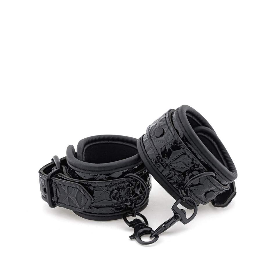 Czarne kajdanki ze sztucznej skóry i neoprenu na nadgarstki lub kostki